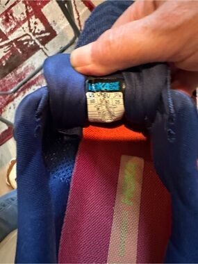 Hoka One One Navy Running Shoe with Pink Insole and Orange Heel